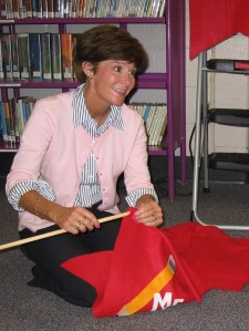 Betsy is preparing to hang the classroom banners she has made for Devon Elementary since 1998. 